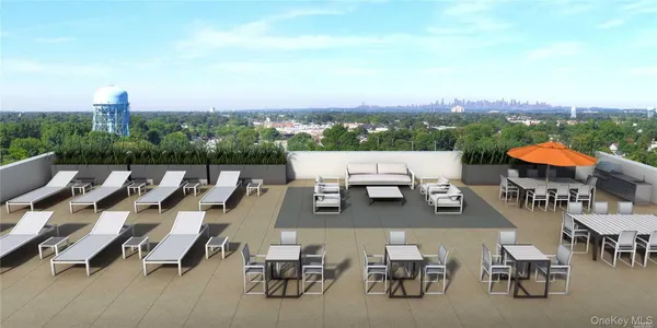 an aerial view of a terrace with outdoor seating and city view