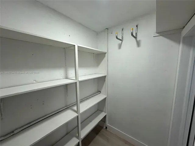 a view of an empty walk in closet