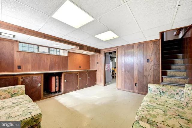 a bedroom with a bed and dresser