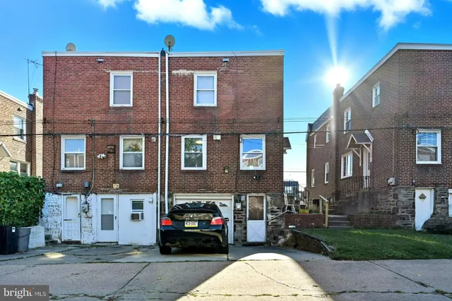 a view of a brick building with many windows