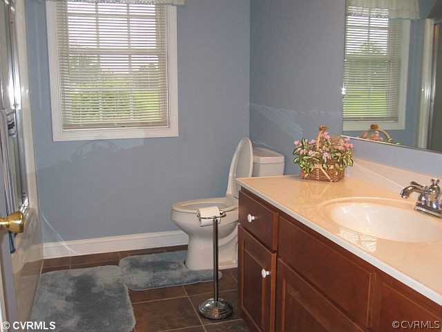 535 Levi Road Green Bay, VA 23942 - Photo 16 of 19 a bathroom with a sink a toilet and a window