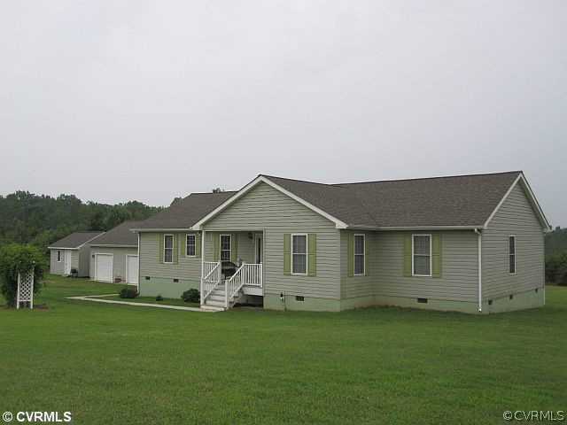 535 Levi Road Green Bay, VA 23942 - Photo 2 of 19 a front view of a house with a garden