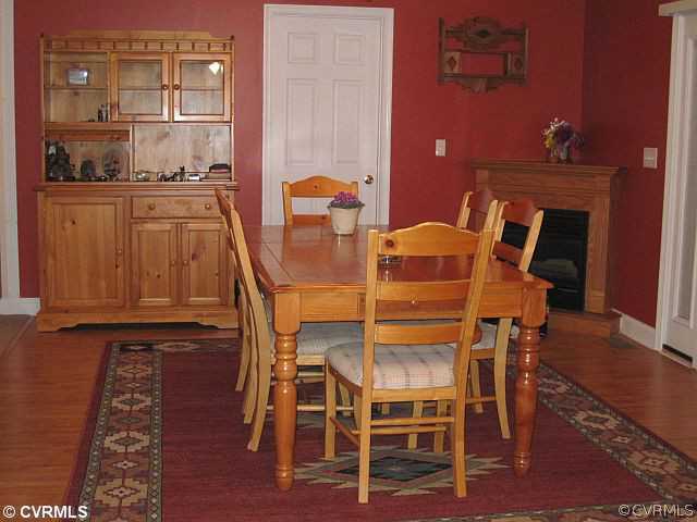 535 Levi Road Green Bay, VA 23942 - Photo 7 of 19 a dining room with furniture and wooden floor