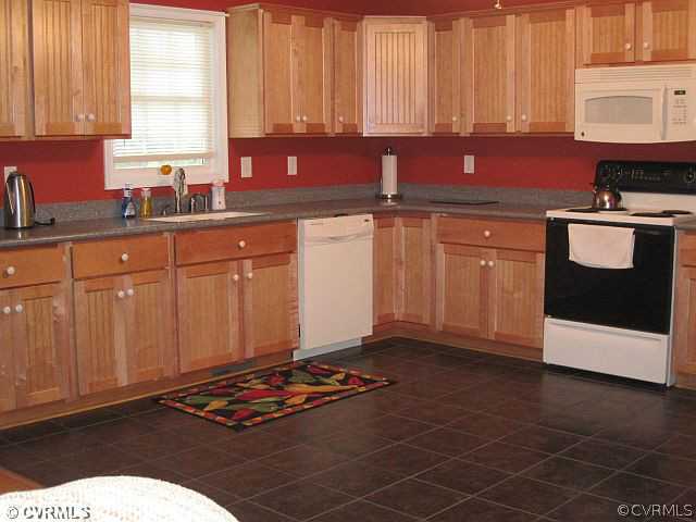 535 Levi Road Green Bay, VA 23942 - Photo 8 of 19 a kitchen with stainless steel appliances granite countertop a sink stove and cabinets