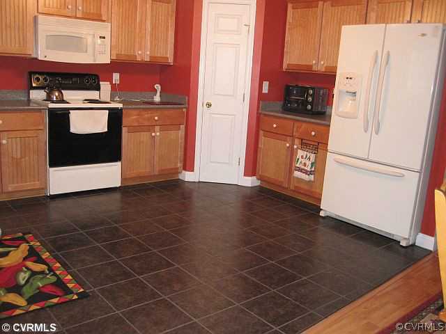 535 Levi Road Green Bay, VA 23942 - Photo 9 of 19 a kitchen with stainless steel appliances a refrigerator sink and cabinets