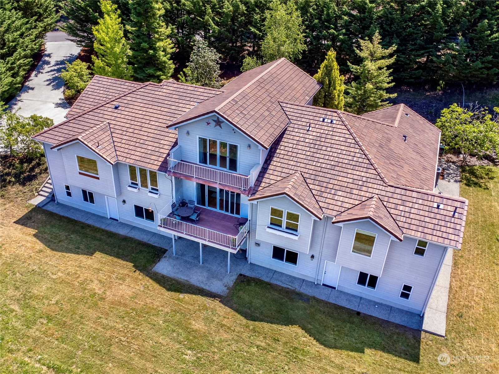 272 Ravens Ridge Road Sequim, WA 98382 - Photo 1 of 40 an aerial view of a house with swimming pool