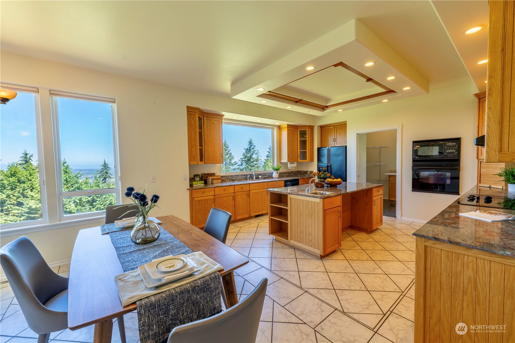 272 Ravens Ridge Road Sequim, WA 98382 - Photo 15 of 40 a view of a dining room with furniture a kitchen and chandelier