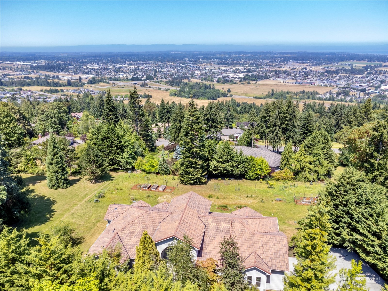 272 Ravens Ridge Road Sequim, WA 98382 - Photo 2 of 40 an aerial view of a houses with a yard