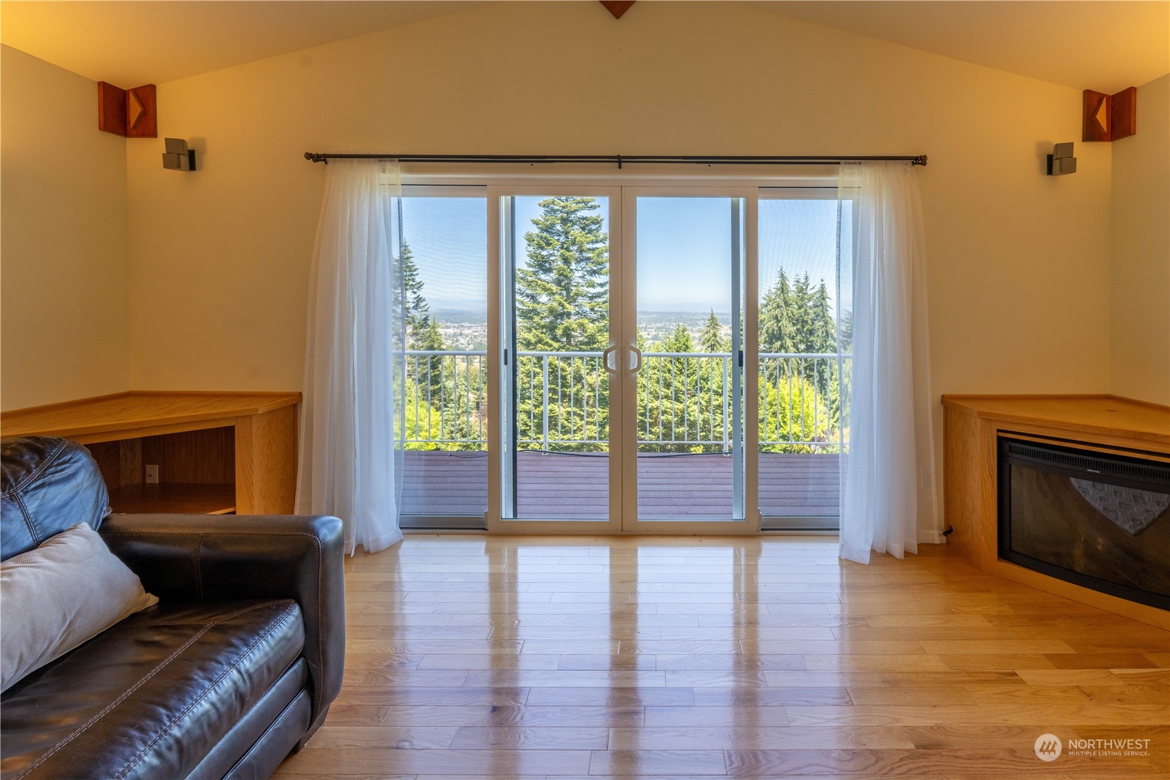 272 Ravens Ridge Road Sequim, WA 98382 - Photo 23 of 40 a living room with furniture and a fireplace