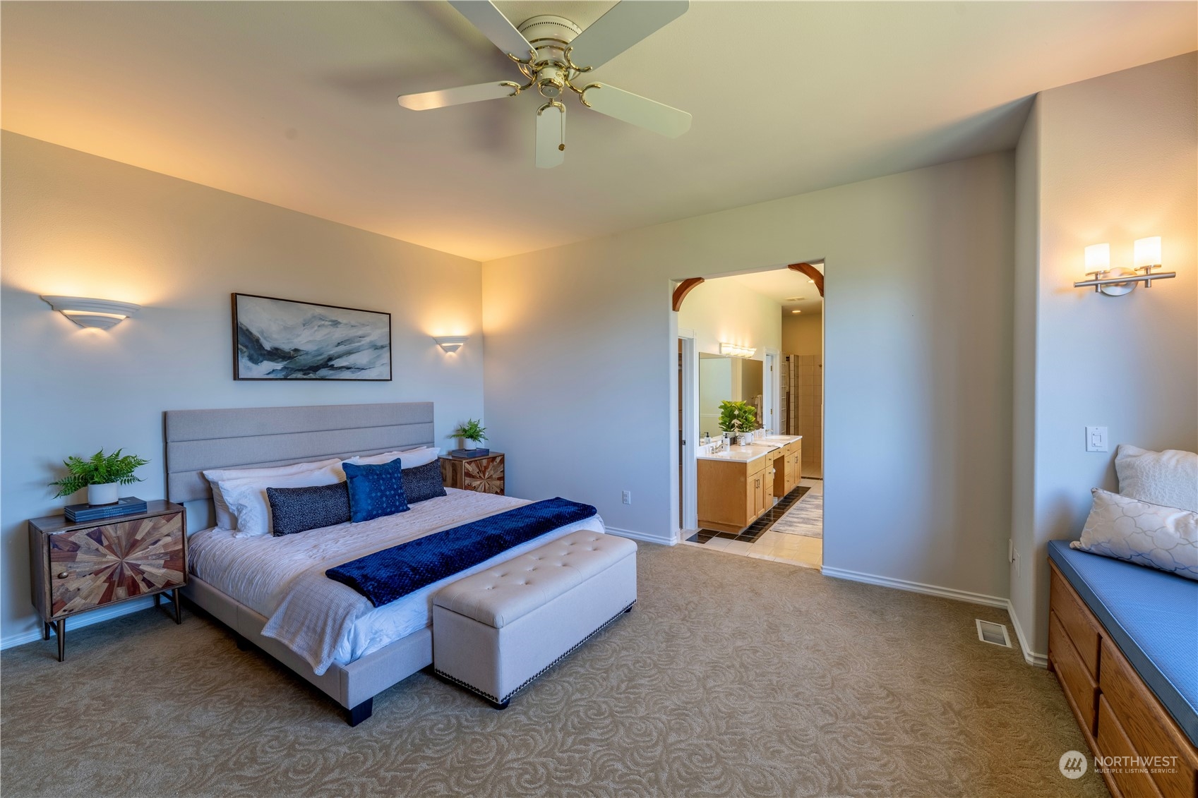 272 Ravens Ridge Road Sequim, WA 98382 - Photo 27 of 40 a bedroom with a bed and a chandelier