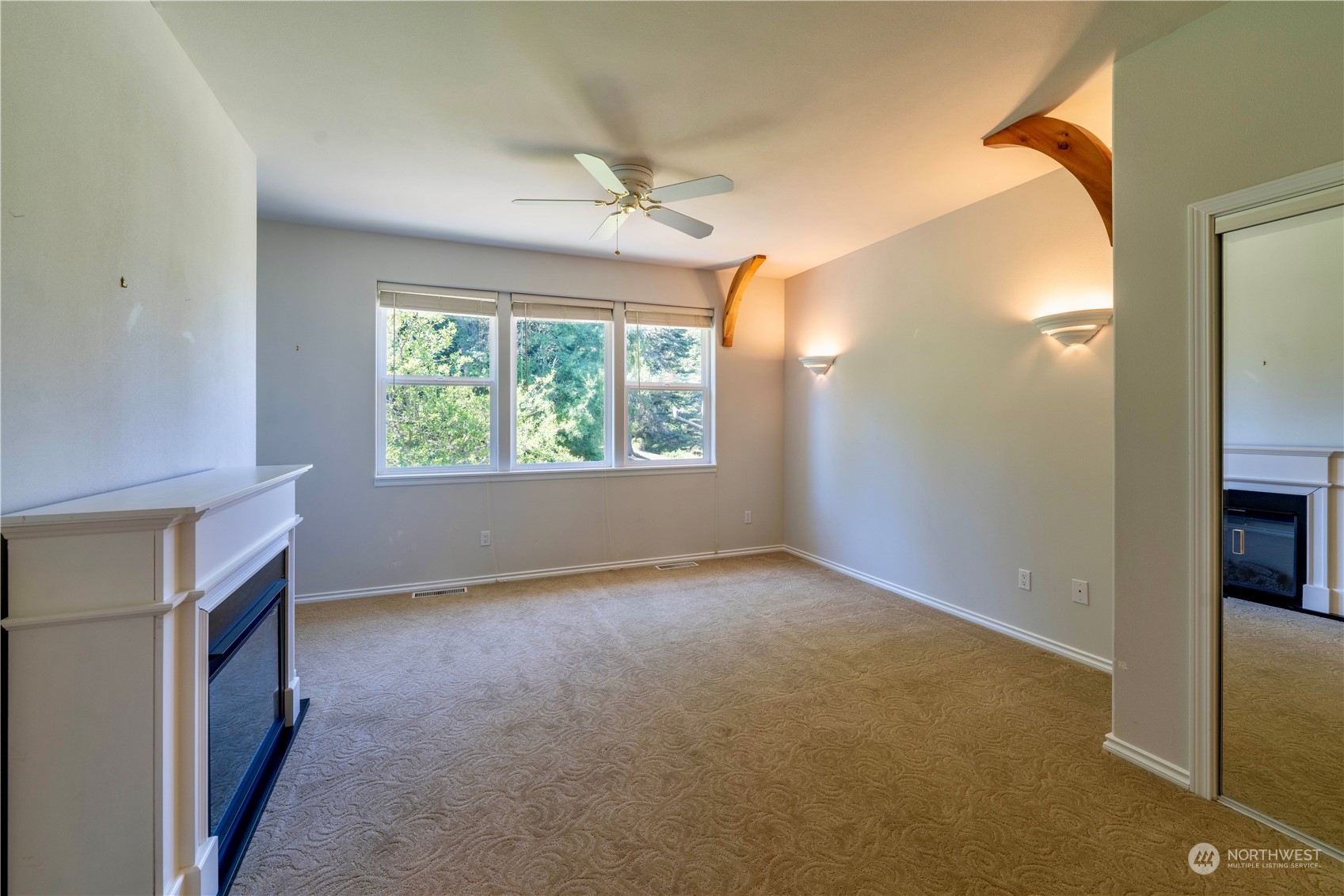 272 Ravens Ridge Road Sequim, WA 98382 - Photo 31 of 40 an empty room with windows and entrance