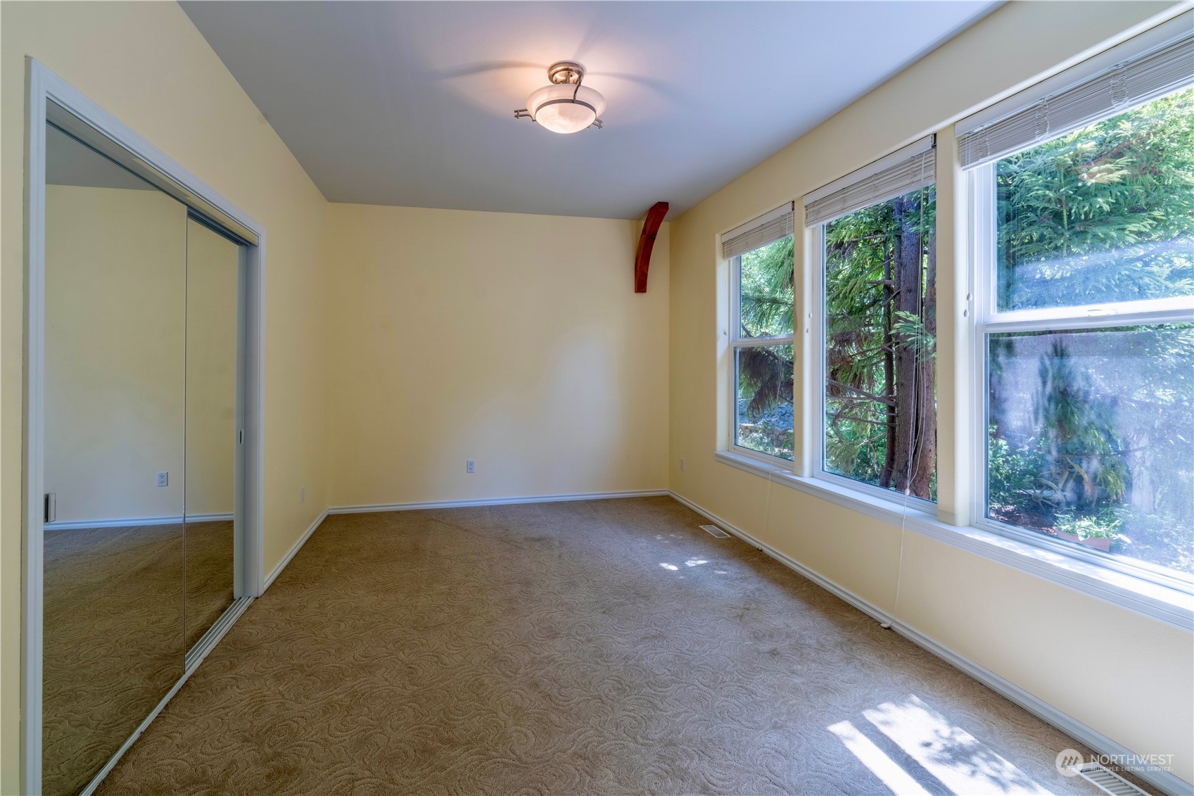 272 Ravens Ridge Road Sequim, WA 98382 - Photo 34 of 40 a view of an empty room with a window