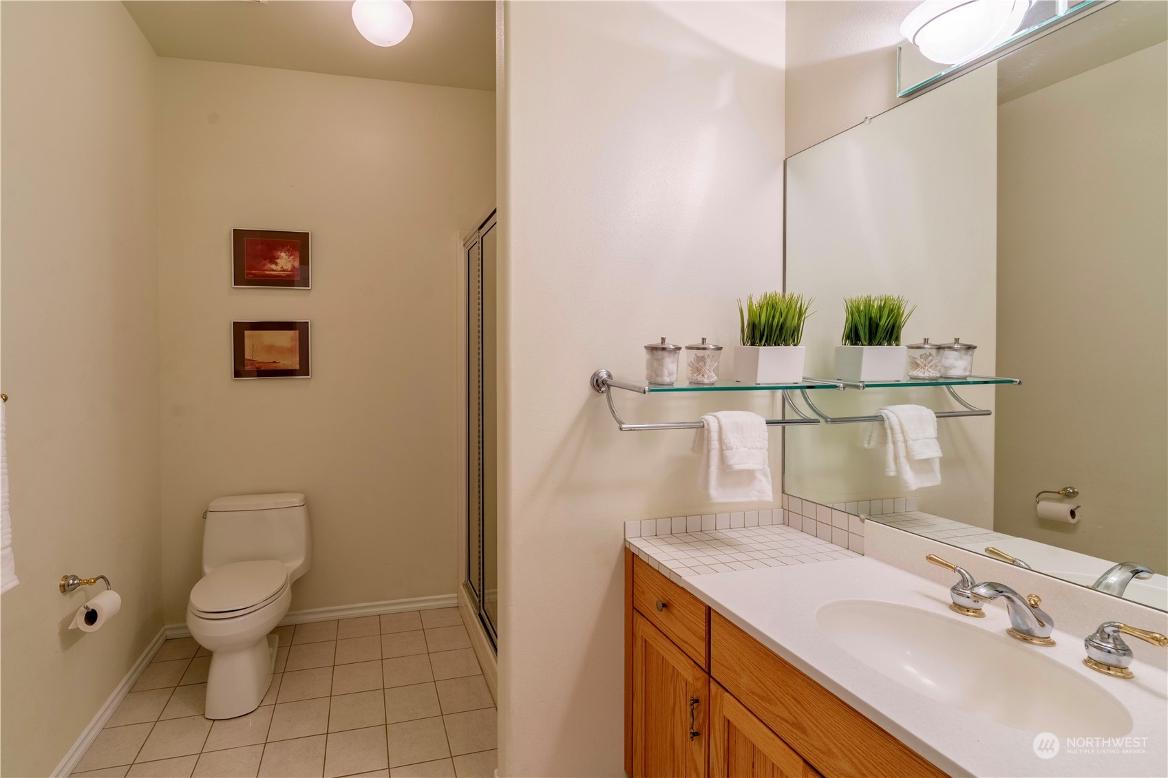 272 Ravens Ridge Road Sequim, WA 98382 - Photo 35 of 40 a bathroom with a sink a toilet and mirror