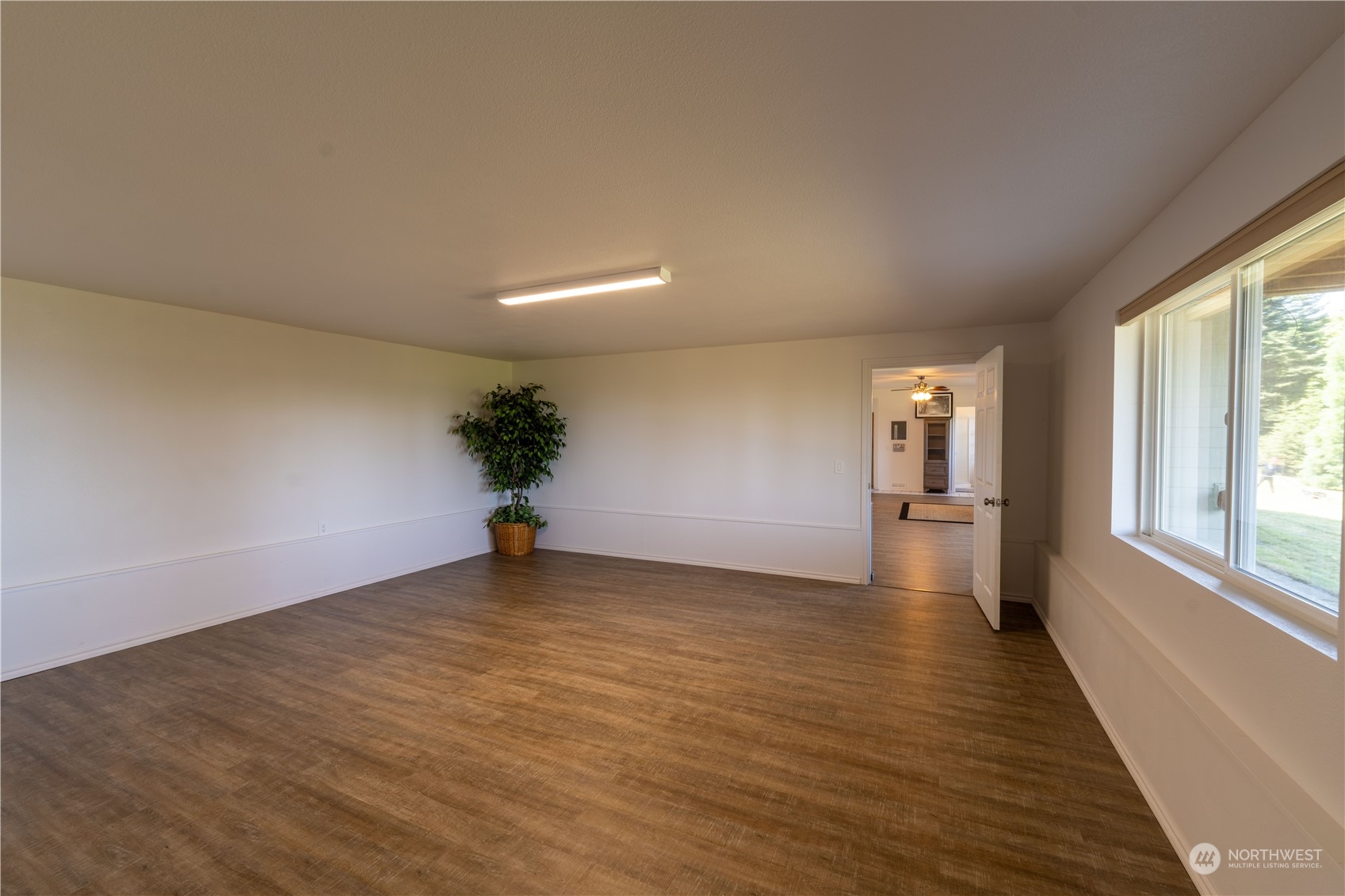 272 Ravens Ridge Road Sequim, WA 98382 - Photo 40 of 40 a view of a room with wooden floor and a window
