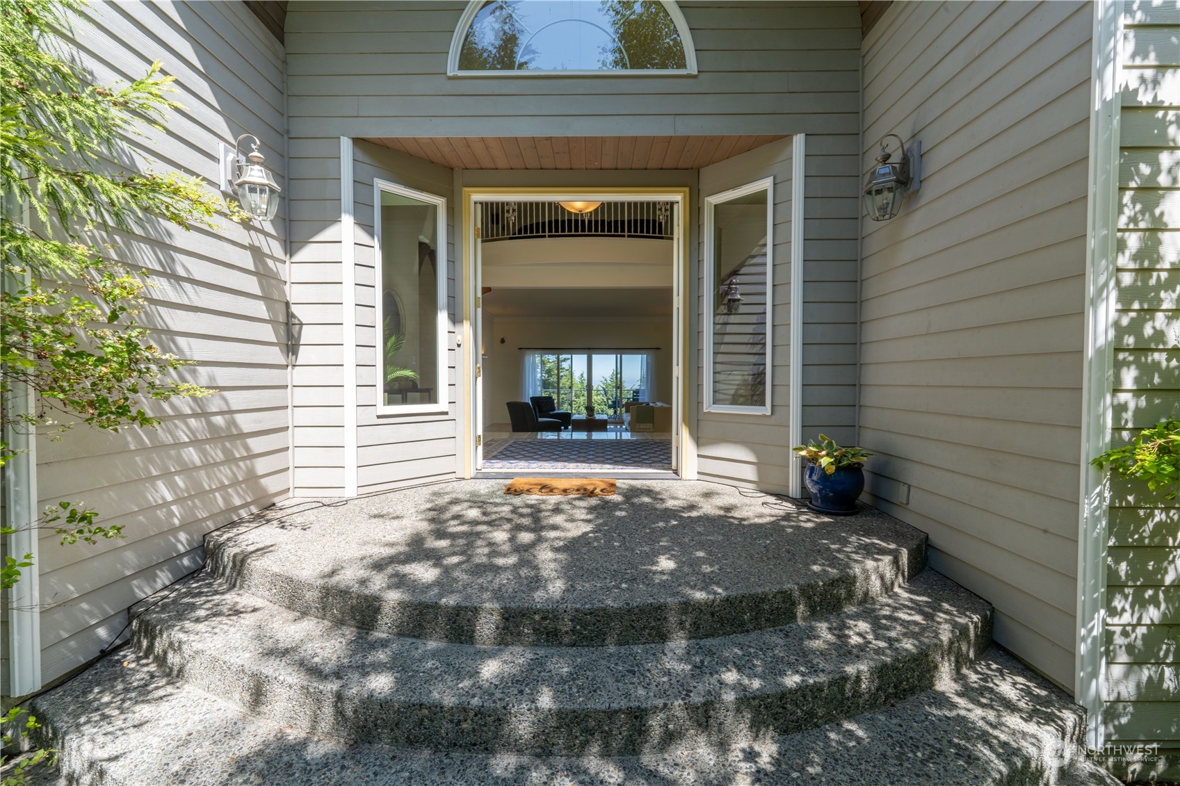 272 Ravens Ridge Road Sequim, WA 98382 - Photo 5 of 40 a front view of a house with a yard