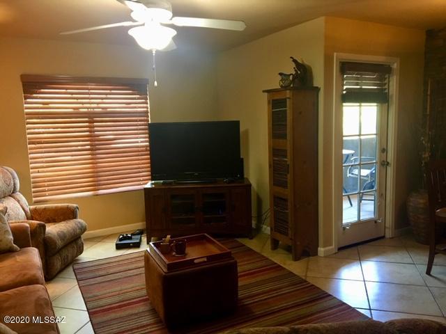 5751 North Kolb Road, Unit 36203 Tucson, AZ 85750 - Photo 3 of 25 a living room with furniture and a flat screen tv