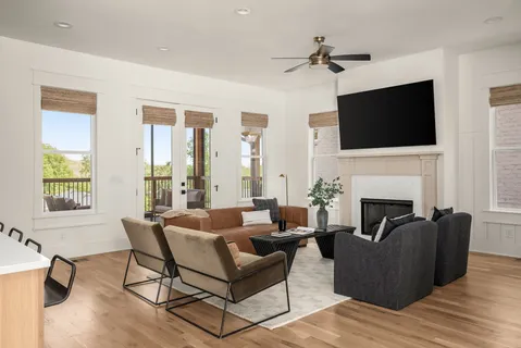 a living room with furniture fireplace and a flat screen tv