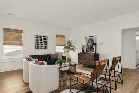 a living room with furniture and a window