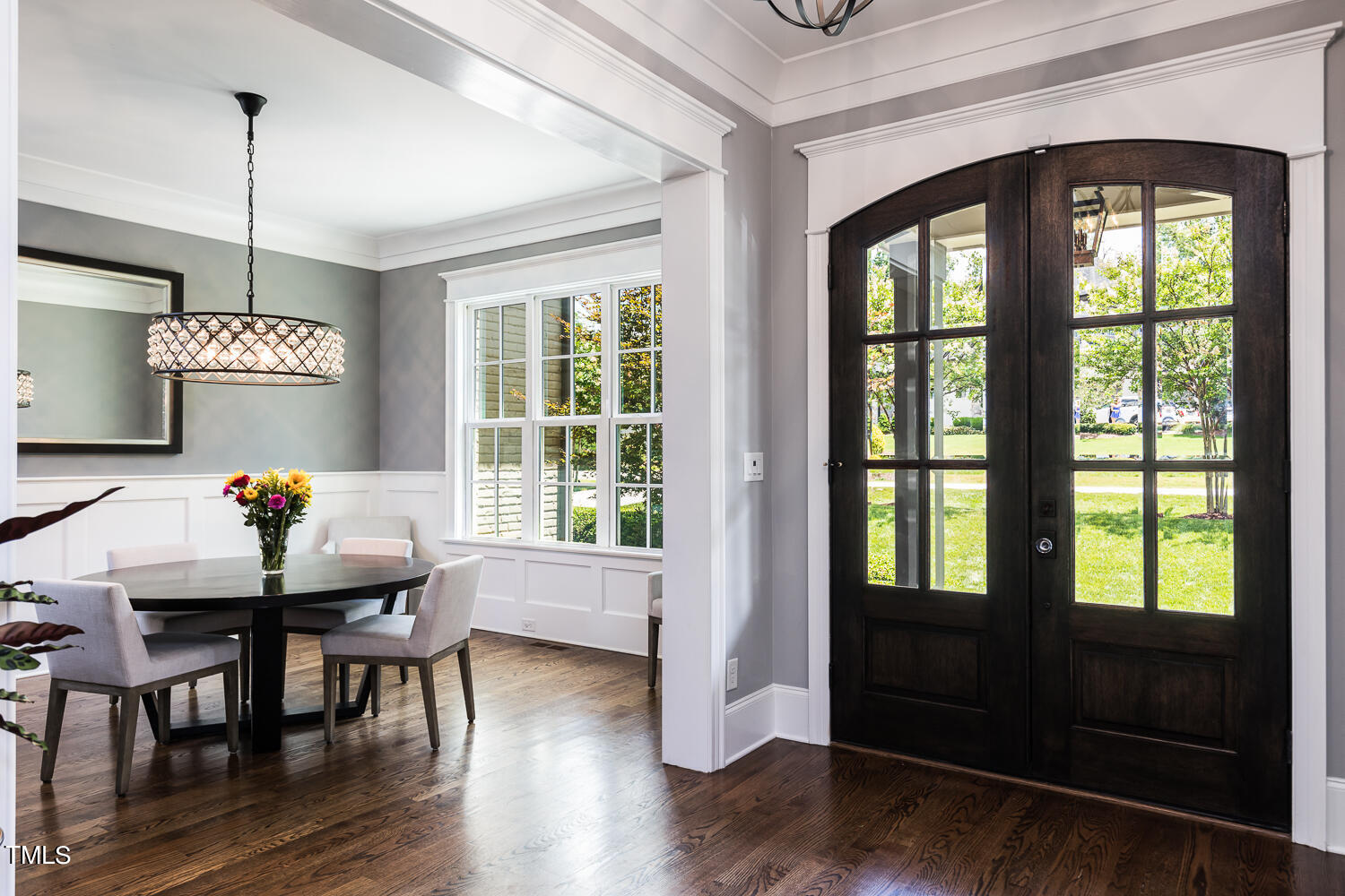 11405 Royal Amber Way Raleigh, NC 27614 - Photo 11 of 61 a dining room with furniture a chandelier and wooden floor