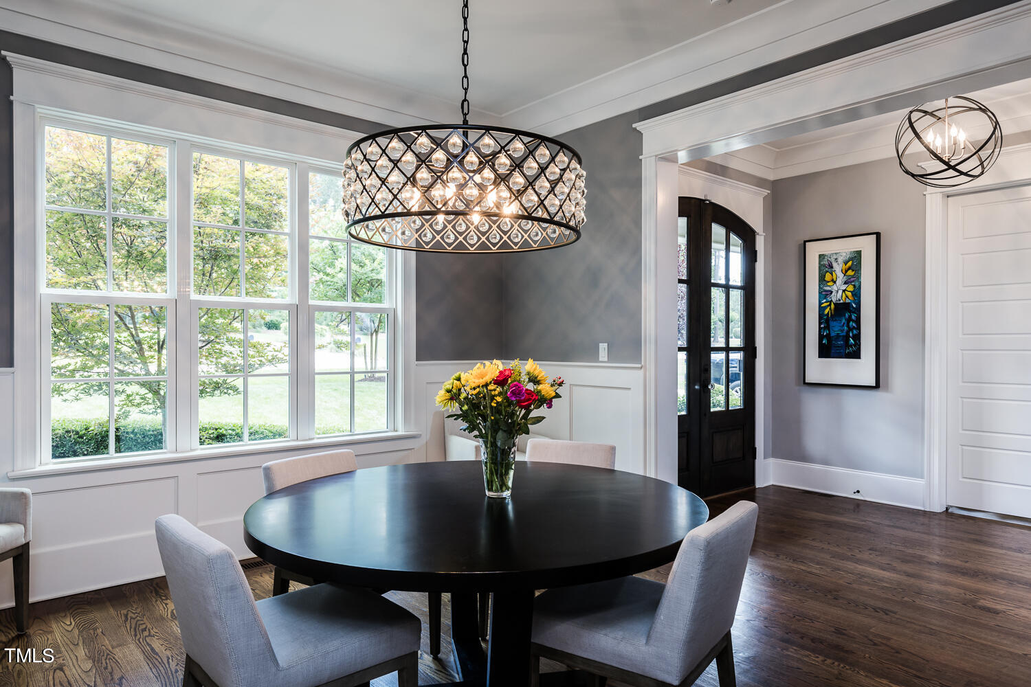 11405 Royal Amber Way Raleigh, NC 27614 - Photo 13 of 61 a view of a dining room with furniture a chandelier and wooden floor
