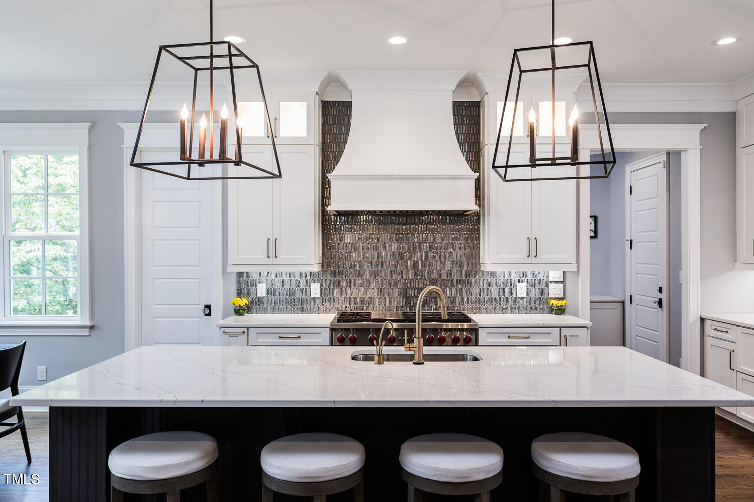 11405 Royal Amber Way Raleigh, NC 27614 - Photo 24 of 61 a kitchen with a table chairs and white cabinets
