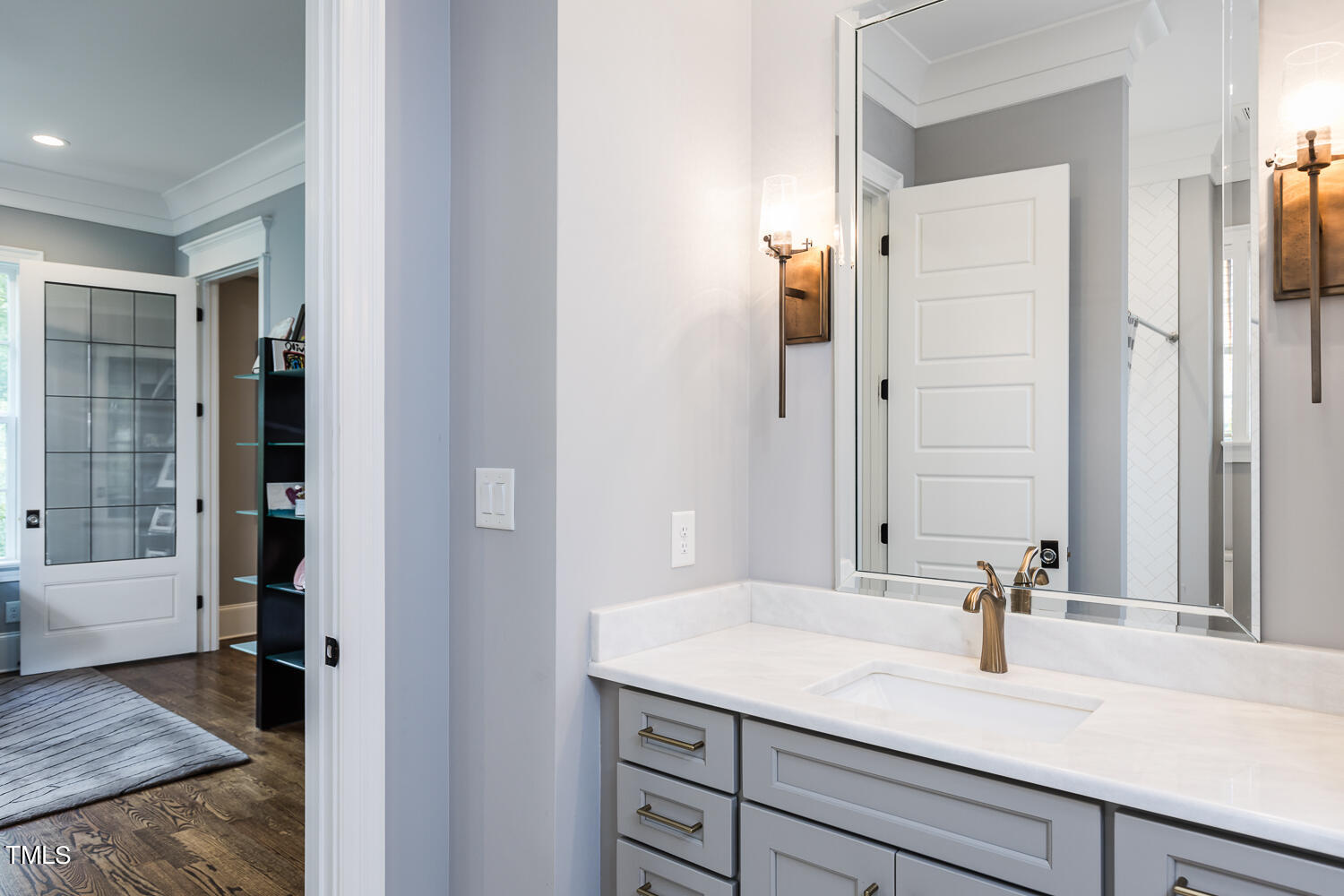 11405 Royal Amber Way Raleigh, NC 27614 - Photo 35 of 61 a bathroom with a granite countertop sink a mirror and a shower