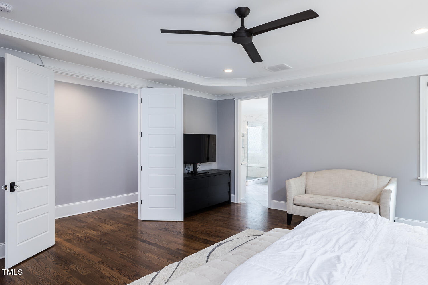 11405 Royal Amber Way Raleigh, NC 27614 - Photo 39 of 61 a bedroom with a bed and a flat screen tv