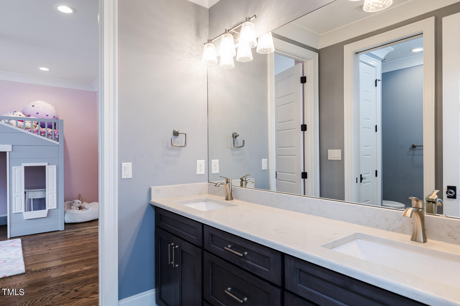 11405 Royal Amber Way Raleigh, NC 27614 - Photo 44 of 61 a bathroom with a sink double vanity and a mirror