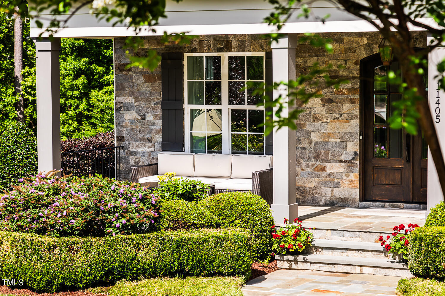 11405 Royal Amber Way Raleigh, NC 27614 - Photo 5 of 61 a front view of a house with a garden