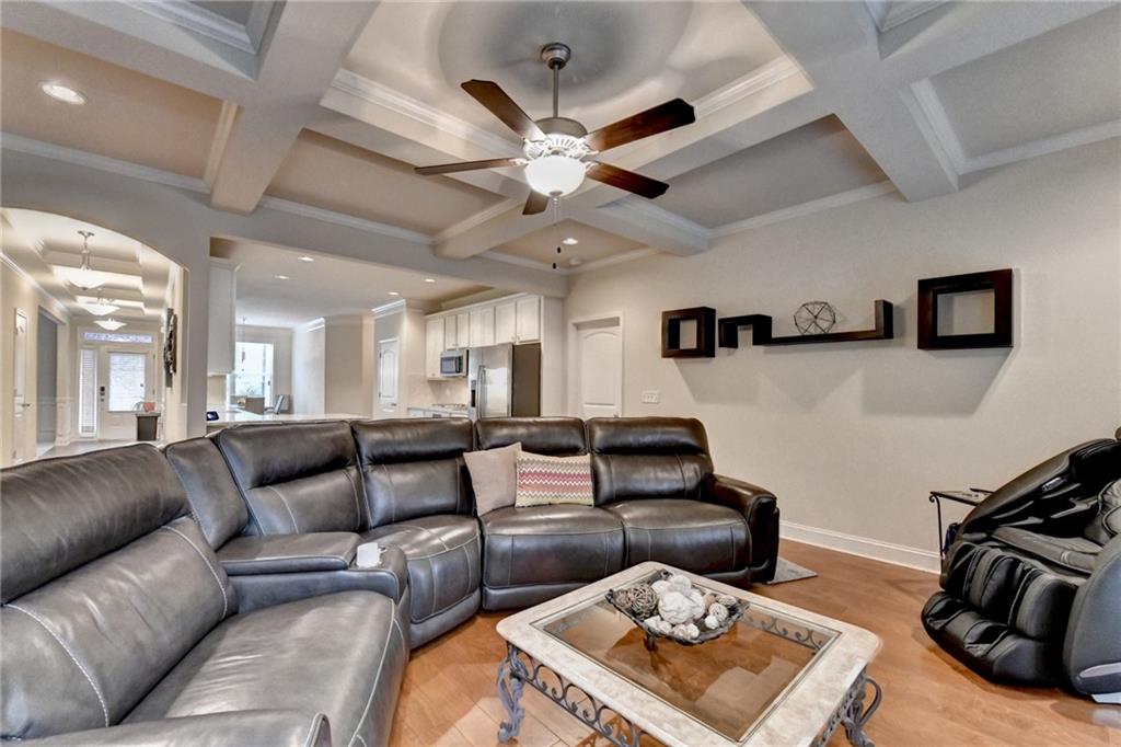 2583 Madison Mae Lane Grayson, GA 30017 - Photo 16 of 43 a living room with furniture ceiling fan and a rug