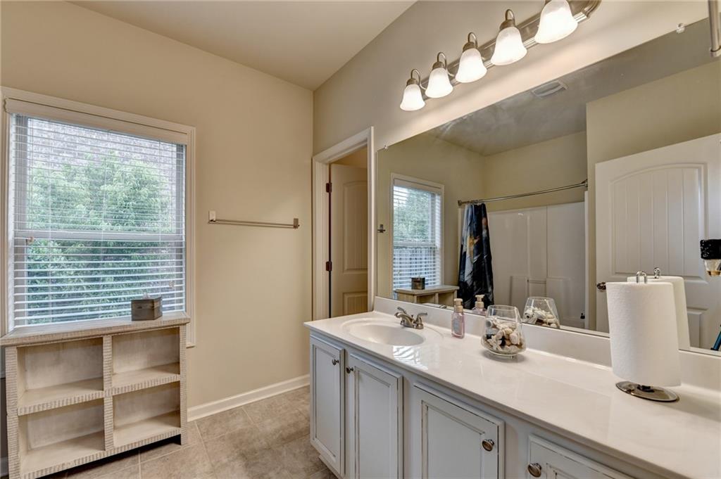 2583 Madison Mae Lane Grayson, GA 30017 - Photo 20 of 43 a bathroom with a sink double vanity and a mirror