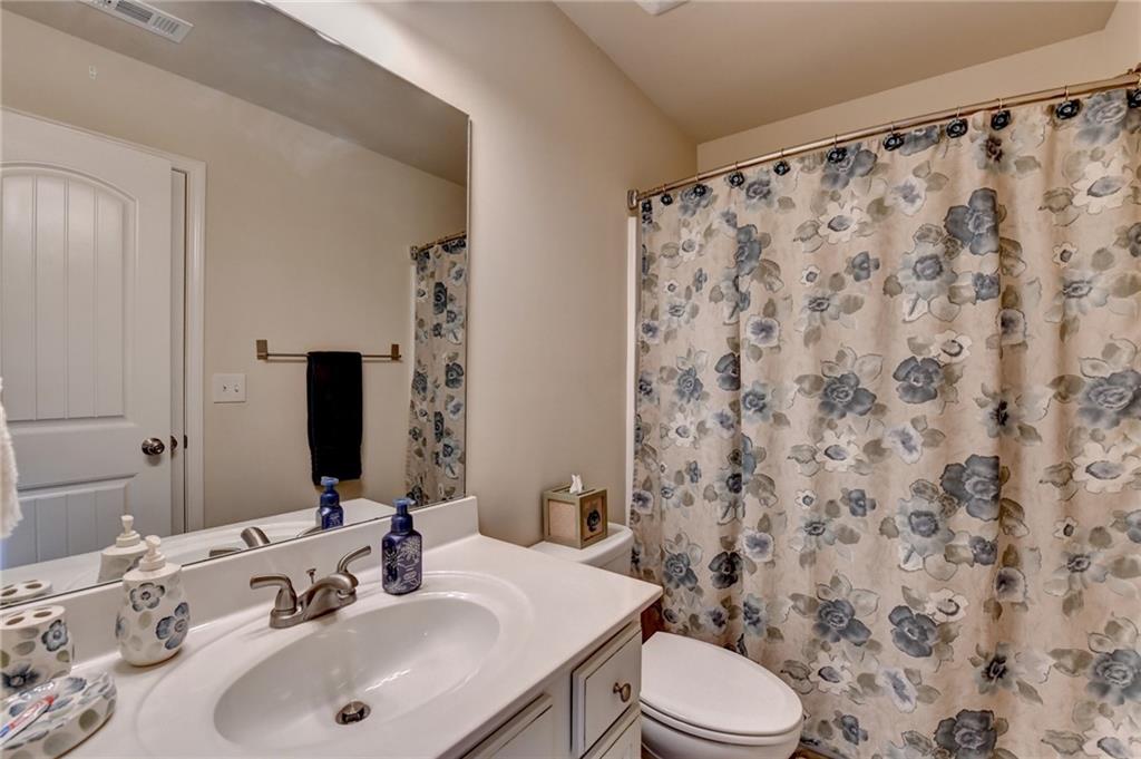 2583 Madison Mae Lane Grayson, GA 30017 - Photo 30 of 43 a bathroom with a sink and a mirror