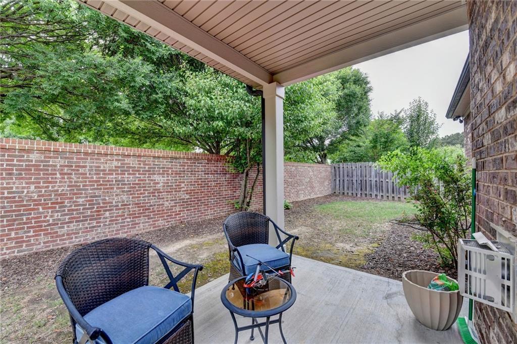 2583 Madison Mae Lane Grayson, GA 30017 - Photo 36 of 43 a backyard of a house with table and chairs