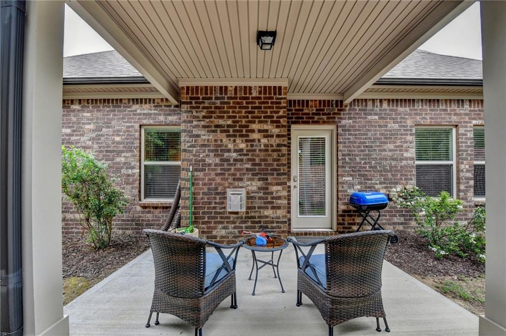 2583 Madison Mae Lane Grayson, GA 30017 - Photo 37 of 43 a patio with table and chairs