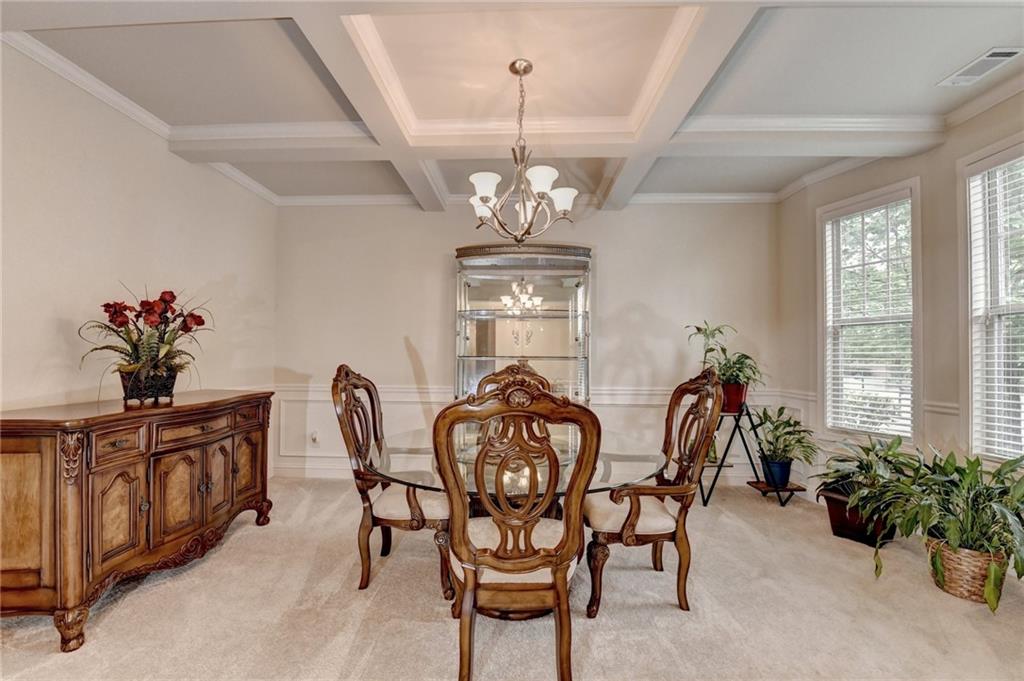 2583 Madison Mae Lane Grayson, GA 30017 - Photo 4 of 43 a view of a dining room with furniture window and outside view