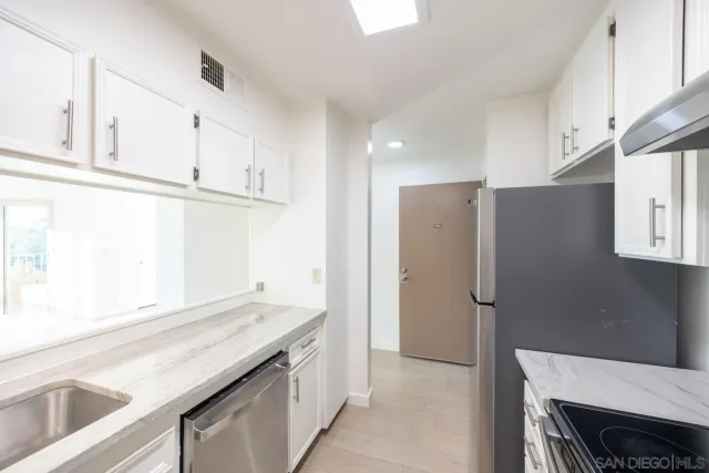 a view of a town with mountains in the background