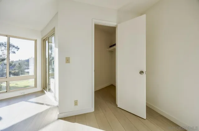 a view of a town with mountains in the background