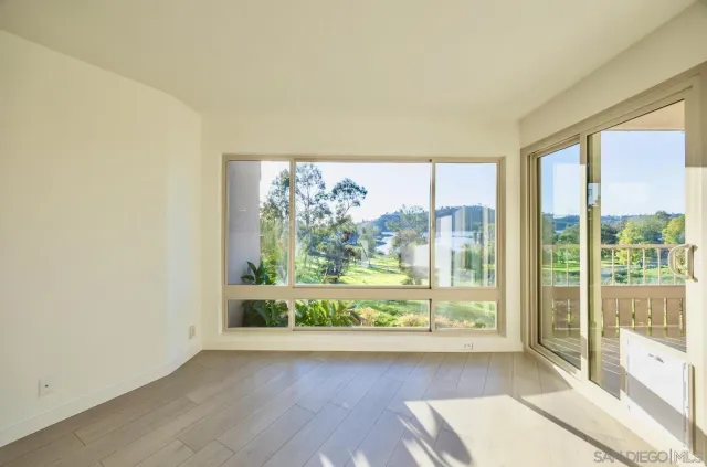 a kitchen with stainless steel appliances granite countertop a sink and a stove with wooden floor