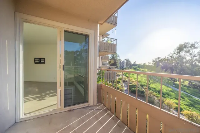 a view of a large building with a swimming pool