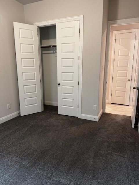 1432 Ridge Runner Drive Georgetown, TX 78628 - Photo 23 of 27 Unfurnished bedroom featuring a closet and dark colored carpet