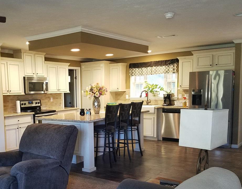 6363 Gordon Lawrence Road Santa Fe, TN 38482 - Photo 2 of 20 a view of kitchen with refrigerator a dining table and chairs