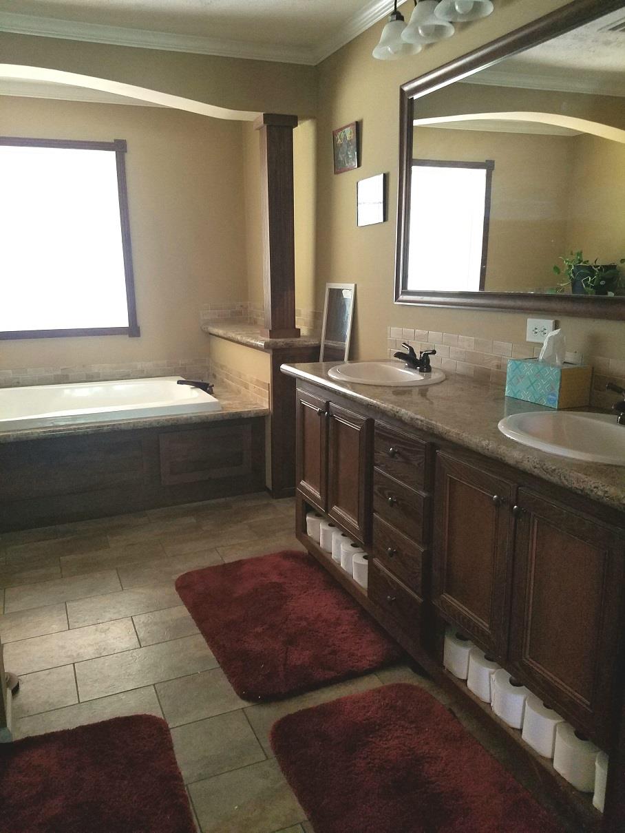 6363 Gordon Lawrence Road Santa Fe, TN 38482 - Photo 6 of 20 a bathroom with a tub sink and mirror