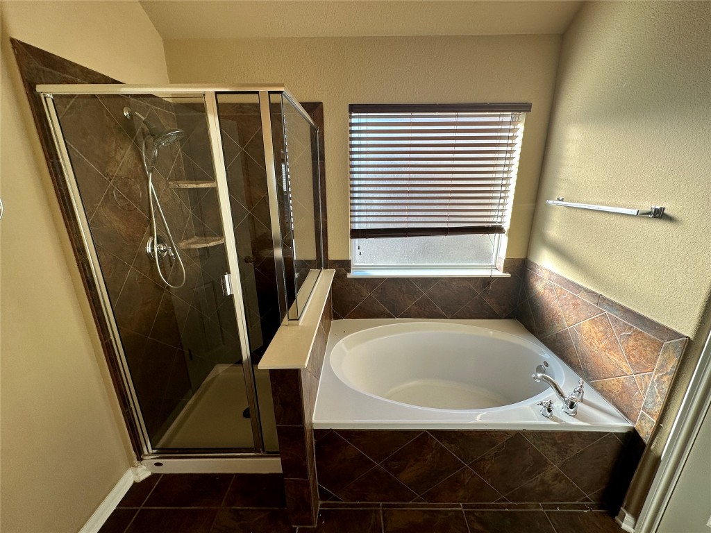 3713 Broadwinged Hawk Cove Austin, TX 78738 - Photo 26 of 37 a bathroom with a sink a toilet and a shower