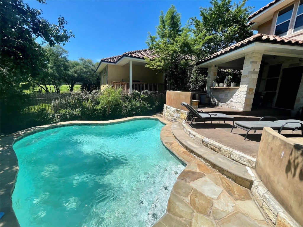 3713 Broadwinged Hawk Cove Austin, TX 78738 - Photo 33 of 37 a view of backyard with barbeque grill and outdoor seating