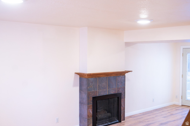 1269 North 400 East, Unit 3 Logan, UT 84341 - Photo 6 of 23 Fireplace featuring a stone tile surround and a wood mantel