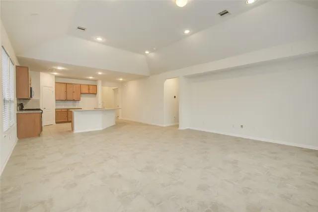 a view of kitchen with white cabinets