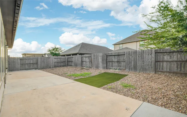 a view of backyard with green space