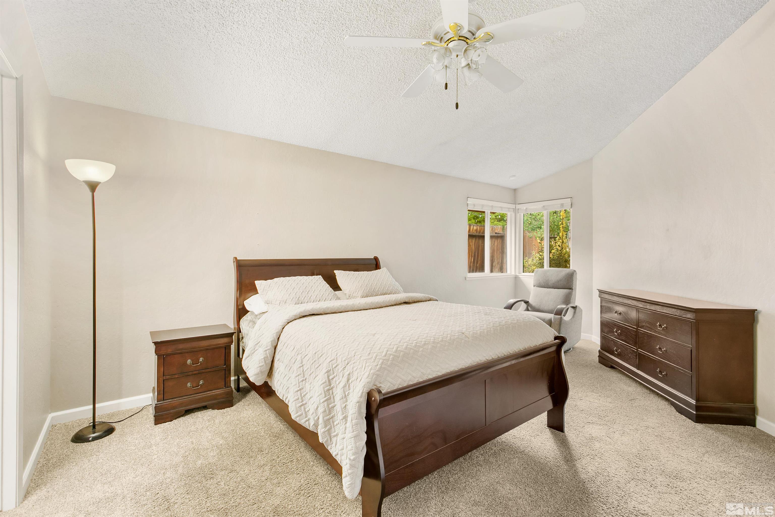 1394 Ambassador Drive Reno, NV 89523 - Photo 13 of 28 a bedroom with a bed and a dresser