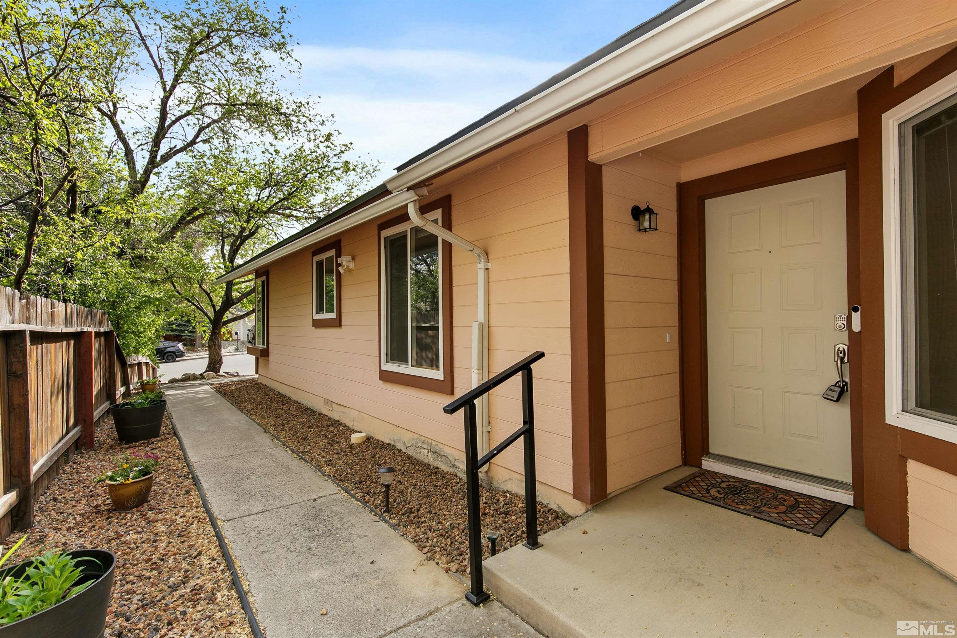 1394 Ambassador Drive Reno, NV 89523 - Photo 4 of 28 a front view of a house with a yard