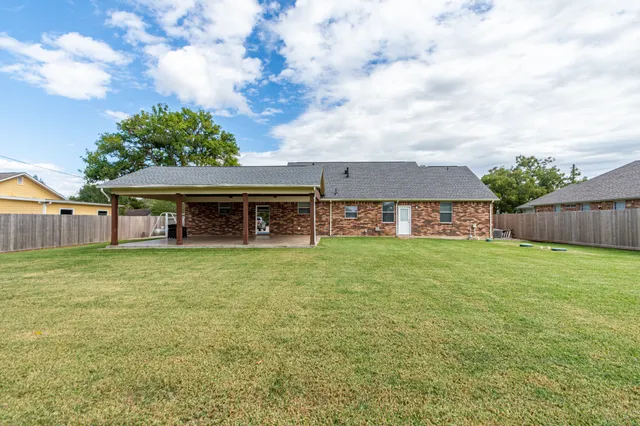 front view of a house with a big yard